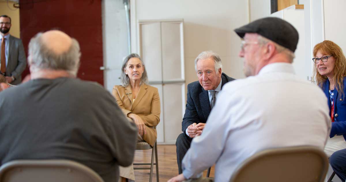 Photo of Congressman Richard Neal and Mayor LaChapelle meeting with RSI staff and clients.